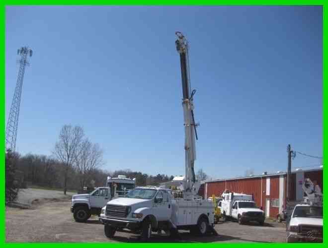 FORD F750 CAT 6 SPEED WITH COMMANDER 4045 DIGGER (2001)